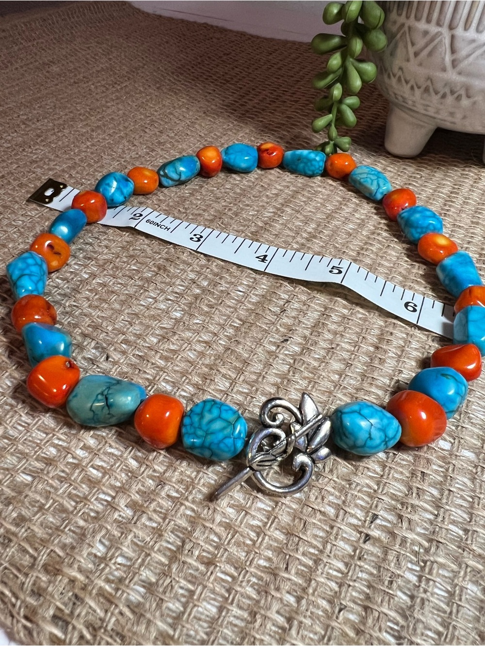 Handmade Turquoise & coral Beaded Necklace with Silver colored decorative Clasp.